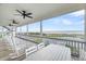 Expansive porch offering serene views of the ocean from a comfortable seating area at 67 Lost Village Trl # 4, Edisto Island, SC 29438