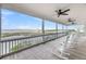 Inviting porch with rocking chairs and ocean vistas, perfect for relaxing and enjoying the view at 67 Lost Village Trl # 4, Edisto Island, SC 29438