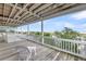 Open porch with ocean views offers a tranquil spot to unwind and appreciate the surrounding scenery at 67 Lost Village Trl # 4, Edisto Island, SC 29438