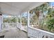 View from the porch showcasing white rocking chairs overlooking lush greenery at 67 Lost Village Trl # 4, Edisto Island, SC 29438