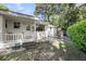 Cozy backyard featuring a small patio area, lush greenery, and a tranquil setting, great for outdoor enjoyment at 710 W Harrison Rd, Charleston, SC 29407