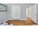 Spacious bedroom showcases wood floors, with a closet, and door to ensuite bath at 710 W Harrison Rd, Charleston, SC 29407