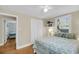 Cozy bedroom featuring hardwood floors, neutral walls, and a window with natural light near a large bed at 710 W Harrison Rd, Charleston, SC 29407