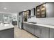 Modern kitchen features stainless steel appliances, grey cabinets, and subway tile backsplash at 710 W Harrison Rd, Charleston, SC 29407