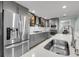 Well-equipped kitchen boasting stainless steel appliances and sleek grey cabinetry at 710 W Harrison Rd, Charleston, SC 29407