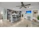 Modern kitchen with stainless steel appliances, breakfast bar, and open layout to living area at 710 W Harrison Rd, Charleston, SC 29407