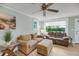 Cozy living room featuring neutral paint and ample natural light through large windows at 710 W Harrison Rd, Charleston, SC 29407