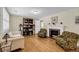 Inviting living room with hardwood floors, a cozy fireplace, and stylish decor at 710 W Harrison Rd, Charleston, SC 29407