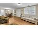 Bright living room showcasing hardwood floors, classic furnishings, and abundant natural light at 710 W Harrison Rd, Charleston, SC 29407