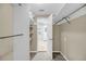 Walk-in closet with rod and shelf storage system and view to bedroom with glass exterior door at 710 W Harrison Rd, Charleston, SC 29407
