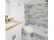 Modern bathroom featuring gray tile shower, white toilet, and wood countertop vanity at 81 Avondale Ave, Charleston, SC 29407
