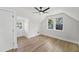 Bright bedroom with hardwood floors, a ceiling fan, and two large windows at 81 Avondale Ave, Charleston, SC 29407