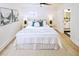 Bright bedroom with a queen bed, stylish wall art and ensuite bathroom at 81 Avondale Ave, Charleston, SC 29407