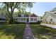 Charming home featuring a covered porch, manicured lawn, and delightful curb appeal at 81 Avondale Ave, Charleston, SC 29407