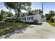 Charming single-Gathering home with well-manicured lawn, concrete driveway, and classic architectural details at 81 Avondale Ave, Charleston, SC 29407