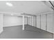 Clean, empty garage with a freshly painted floor and updated lighting, ready for use at 81 Avondale Ave, Charleston, SC 29407