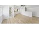 Bright living room with a kitchenette and modern bathroom; natural light streams in from large windows at 81 Avondale Ave, Charleston, SC 29407