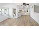 Bright living room with a kitchenette, modern ceiling fan, vinyl floors and an adjoining bathroom at 81 Avondale Ave, Charleston, SC 29407