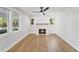 Bright living room featuring hardwood floors, a fireplace, and lots of natural light at 81 Avondale Ave, Charleston, SC 29407