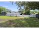 Spacious backyard with lush green grass and white picket fence at 8487 Parkers Ferry Rd, Adams Run, SC 29426