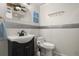 Well-lit bathroom with a modern vanity and toilet with decorative tiling at 8487 Parkers Ferry Rd, Adams Run, SC 29426