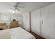Bright bedroom featuring carpet floors and large closet space at 8487 Parkers Ferry Rd, Adams Run, SC 29426