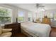 Bright bedroom featuring natural light, hardwood floors, and classic furniture at 8487 Parkers Ferry Rd, Adams Run, SC 29426