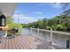 Enjoy river views from this deck, featuring a grill perfect for outdoor cooking and entertaining at 8487 Parkers Ferry Rd, Adams Run, SC 29426