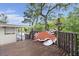Home's deck area includes a big wooden crab statue, with a waterfront view at 8487 Parkers Ferry Rd, Adams Run, SC 29426