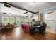 Open floor plan with a dining room area, bar seating, a desk, and a beautiful wood floor at 8487 Parkers Ferry Rd, Adams Run, SC 29426