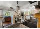 Bright kitchen with stainless steel appliances, white cabinets, wooden accents, tiled countertops, and open shelving at 8487 Parkers Ferry Rd, Adams Run, SC 29426