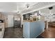 Kitchen with light blue walls, tiled floor, island, and stainless steel appliances at 8487 Parkers Ferry Rd, Adams Run, SC 29426