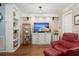 Living room featuring hardwood floors, whitewashed walls, and comfortable furnishings at 8487 Parkers Ferry Rd, Adams Run, SC 29426