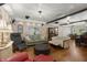 Bright living room with hardwood floors, stylish furnishings, and ample natural light at 8487 Parkers Ferry Rd, Adams Run, SC 29426