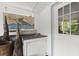 Practical mudroom with a utility sink, storage, and nautical decor for a coastal-themed home at 8487 Parkers Ferry Rd, Adams Run, SC 29426