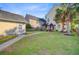 Expansive backyard featuring a gazebo, lush lawn, mature palm tree, and detached garage at 86 Cross Timbers Dr, Summerville, SC 29485