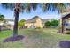 Spacious backyard featuring a shed, a tent-like seating area, grass, and a palm tree at 86 Cross Timbers Dr, Summerville, SC 29485