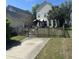Spacious backyard featuring a well-kept lawn and a gazebo, enclosed by a wooden fence at 86 Cross Timbers Dr, Summerville, SC 29485