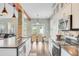 Open dining area with kitchen view, stainless steel appliances, and hardwood floors at 86 Cross Timbers Dr, Summerville, SC 29485