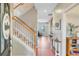Inviting foyer with staircase, wood flooring, and decor providing a warm welcome at 86 Cross Timbers Dr, Summerville, SC 29485