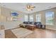 Comfortable living room with hardwood floors, large windows, and stylish furnishings at 86 Cross Timbers Dr, Summerville, SC 29485