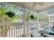 Relaxing front porch offers ample seating and peaceful view of the street in this charming home at 86 Cross Timbers Dr, Summerville, SC 29485