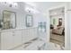 Bright bathroom with double vanity, marble countertops, and modern fixtures at 912 Cheehaw St, Edisto Island, SC 29438