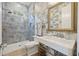 Stylish bathroom with glass shower, unique wallpaper and fixtures at 912 Cheehaw St, Edisto Island, SC 29438