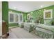 Green bedroom featuring three beds, and bird wallpaper at 912 Cheehaw St, Edisto Island, SC 29438