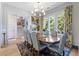 Elegant dining room with large windows and seating for eight at 912 Cheehaw St, Edisto Island, SC 29438