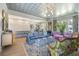 Expansive living room with a coffered ceiling, hardwood floors and abundant natural light at 912 Cheehaw St, Edisto Island, SC 29438