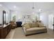 This is a spacious main bedroom featuring a sitting area, neutral walls, and a ceiling fan at 912 Cheehaw St, Edisto Island, SC 29438