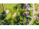 An aerial view showcases the property's proximity to a golf course and the surrounding green landscape at 1187 Out Of Bounds Dr, Summerville, SC 29485