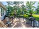 Inviting back deck with seating offers views of manicured lawns and lush golf course surroundings at 1187 Out Of Bounds Dr, Summerville, SC 29485